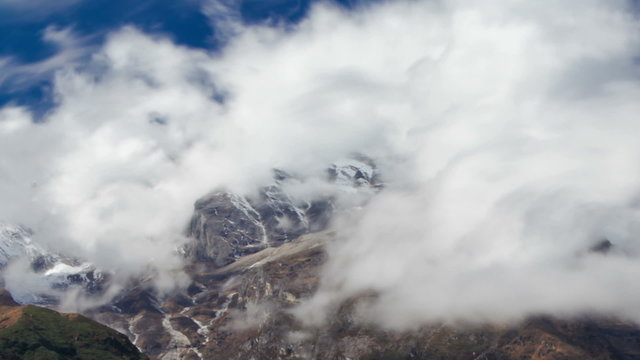 Time-lapse of clouds moving around Himalayan mountains. Cropped.