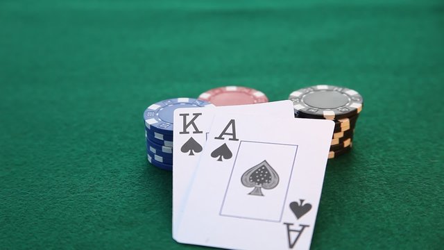 Ace and King placed on poker chip stacks