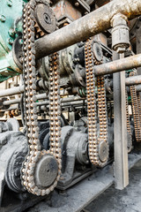 Old gears and chain of industrial machinery parts