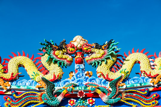Chinese dragon on blue sky background.