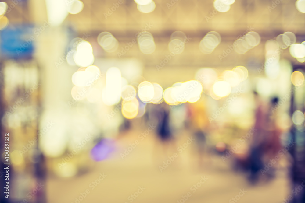 Poster blurred background : crowd of people in expo fair with bokeh lig