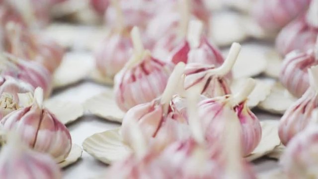 Close-up racking shot of garlic in a market in Rio de Janeiro, Brazil