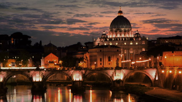 Panning shot of Sunset time-lapse of the Vatican City, from across the Tevere River.