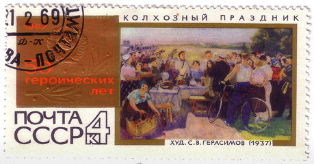 USSR - CIRCA 1967: a post stamp printed in the USSR shows picture "Collective-farm holiday" by S.V.Gerasimov , devoted 50 heroic years, circa 1967