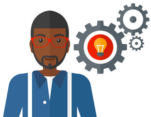 Man with bulb and gears.