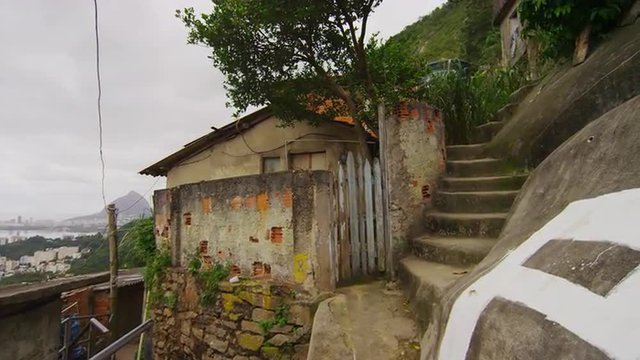 Walking and going up stairs dolly shot in a favela in Rio de Janeiro, Brazil