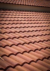 brown tile roof weathered on building residential