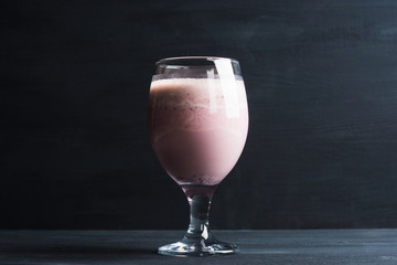 Blackberry smoothie on the wooden background