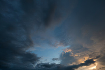 twilight sunset sky with cloudy and sunlight through clouds
