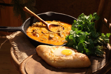 Meat stewed in sauce with a coriander and tomatoes