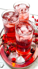 Fresh cocktail with ice on a tray .