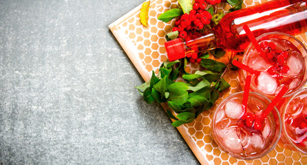 Cocktail with ice and ingredients on a stone tray .  Free space for text.