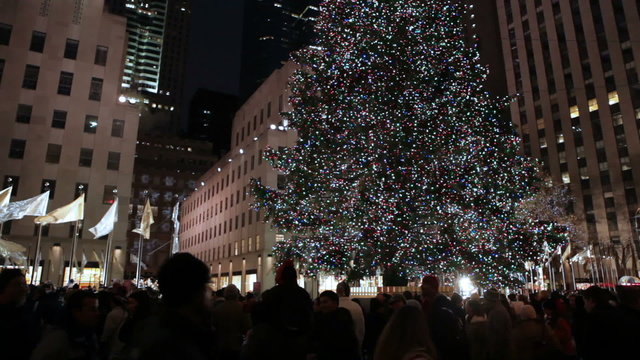 Huge Christmas tree decorated with lights and bulbs in New York.