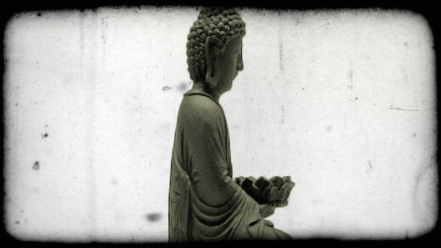 Shot of a buddha. Vintage stylized video clip.