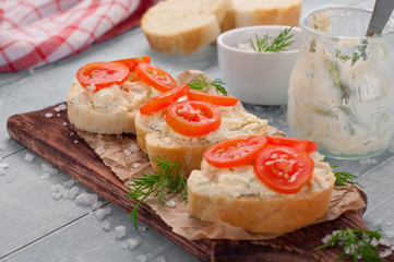 closeup sandwich with cheese, tomatoes and parsley