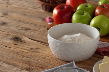 flour in a bowl on wooden table