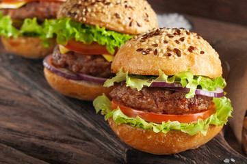 burger on wooden background closeup