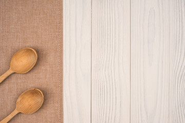 napkin with a wooden spoon on wooden background