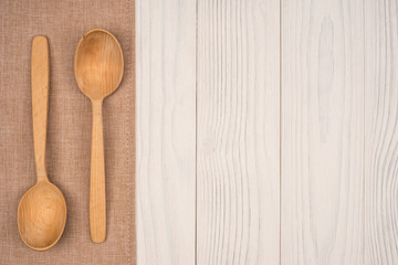 napkin with a wooden spoon on wooden background