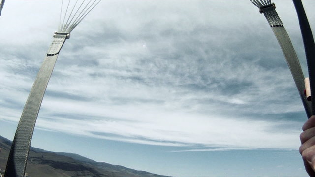 Excited parachutist jumping out of a plane