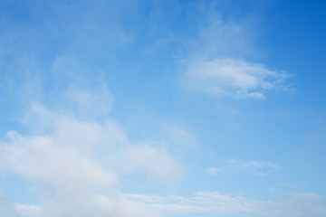 fluffy cloud above blue sky background