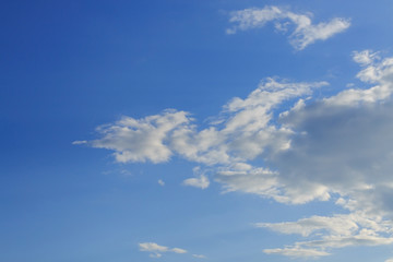 sunlight through cloud on clear blue sky background