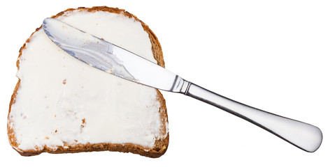 grain bread and Cheese spread sandwich with knife