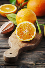Fresh sweet oranges on the wooden table