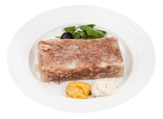 portion of meat aspic with seasonings on plate