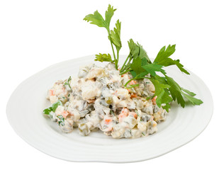 russian salad with mayonnaise decorated with green
