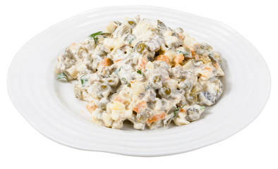 russian salad with mayonnaise on plate isolated