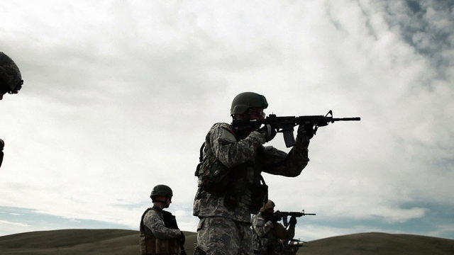 Soldiers practicing shooting at Green Beret firing range