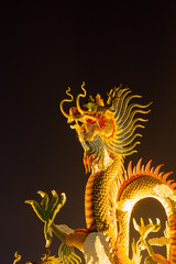 Chinese style dragon statue dragon at night, in Thailand.