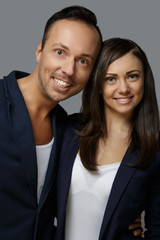 Smiling modern male and female.