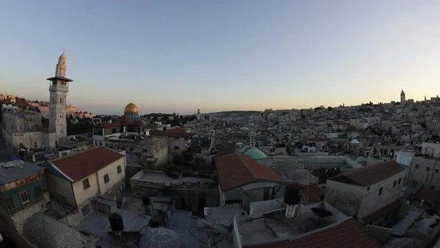 Tracking time-lapse of Jerusalem and the Dome of the Rock at dusk.