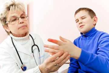 Doctor examining a child in a hospital