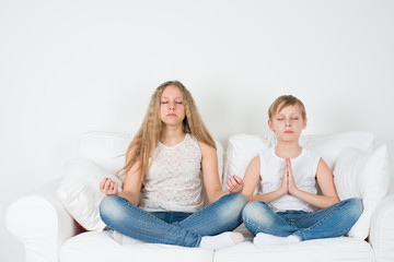 Boy and girl meditate
