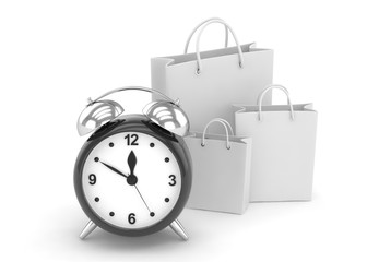 alarm clock and shopping bag (time to buy concept)