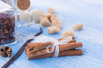 dry tea leaves cinnamon and on wooden background