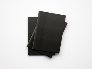Set of black notebooks on the white background. 3d render