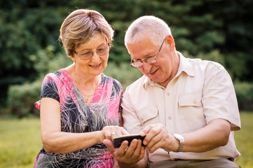 Senior couple with smartphone