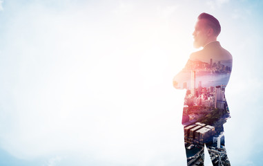 Portrait of stylish businessman. Double exposure city on the background. Wide.