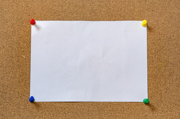 cork board with blank notes