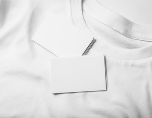Closeup of blanks business cards on white tshirt