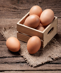 Eggs on wooden table background