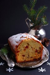 Apple cake with walnuts on a brown background