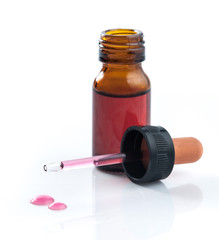 Brown medicine glass bottle with dropper isolated over white