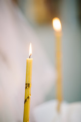 burning thin candle during christening