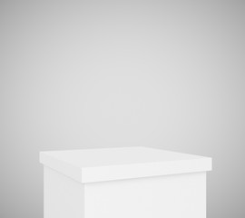White pedestal at blank grey background