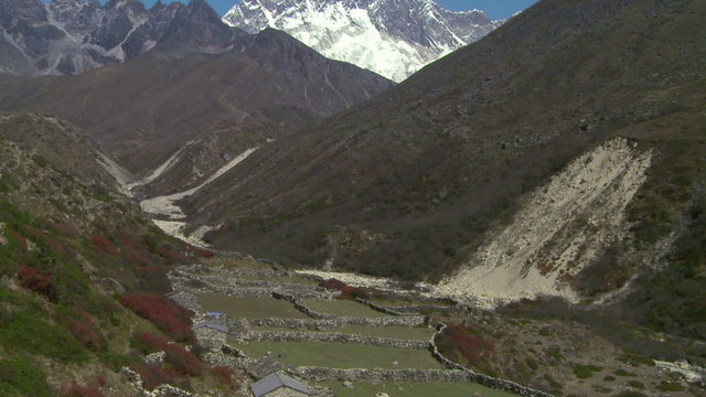Tilt from Mount Everest to a valley below.